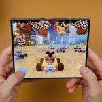 a-person-holding-a-video-game-in-their-hands